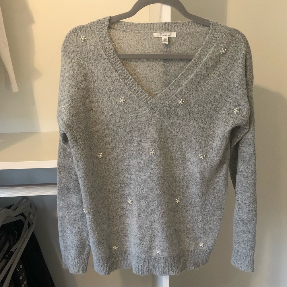 Grey sweater with embroidered detail